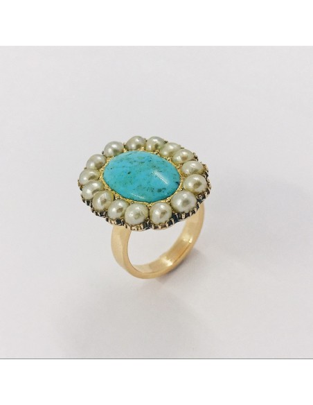 Anillo en oro 18kt con turquesa central y perlas