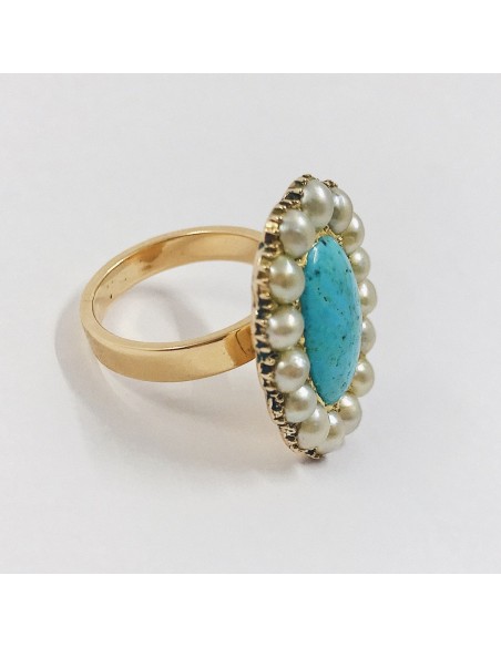 Anillo en oro 18kt con turquesa central y perlas