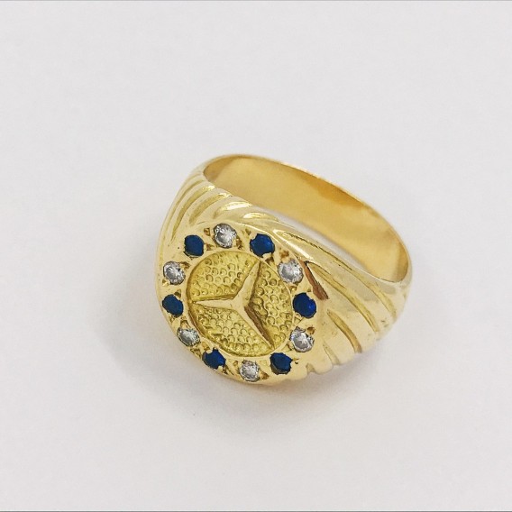 Sello con el sÃ­mbolo de Mercedes-Benz en oro 18kt