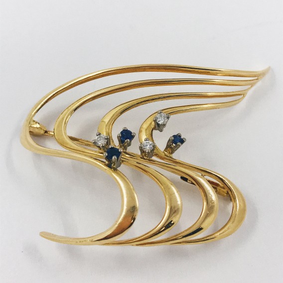 Broche en oro con brillantes.