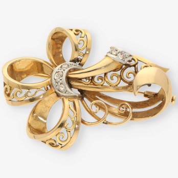 Aguja oro y diamantes