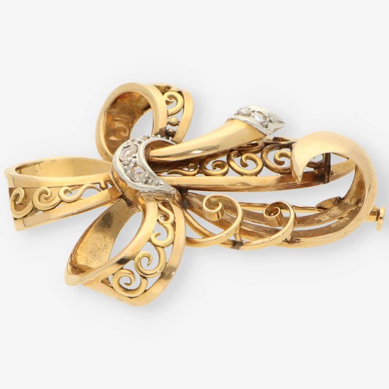 Aguja oro y diamantes