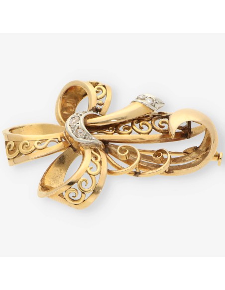 Aguja oro y diamantes