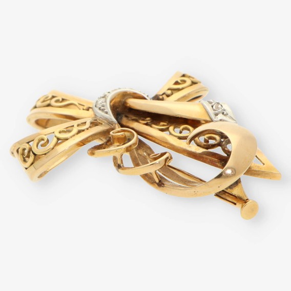 Aguja oro y diamantes