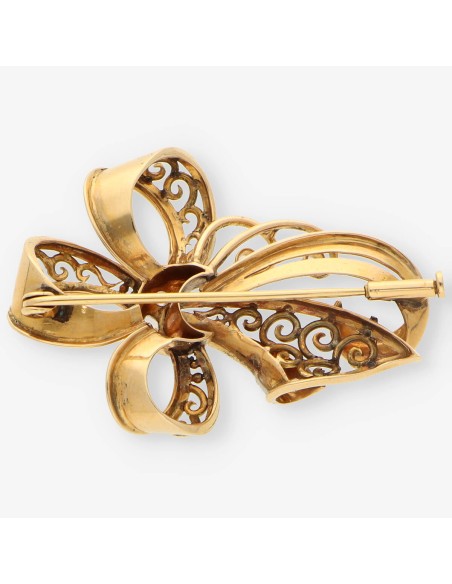 Aguja oro y diamantes