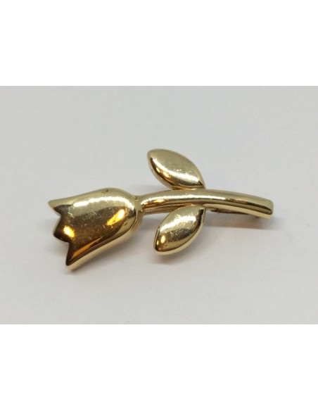 Aguja Tous de oro en forma de flor