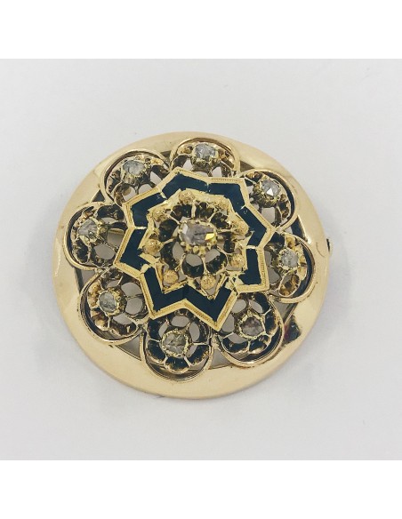 Broche circular de oro con diamantes