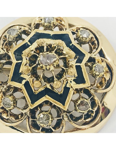 Broche circular de oro con diamantes