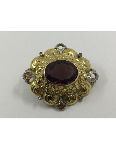 Broche de oro y piedras de color