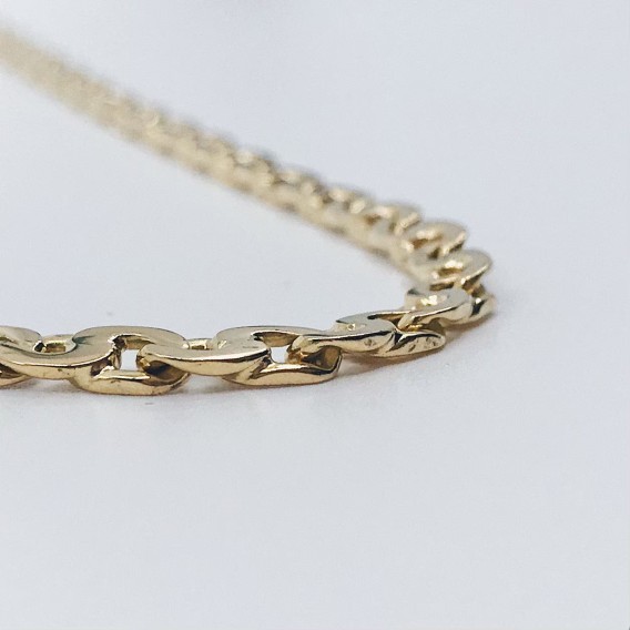 Cadena barbada plana en oro 18kt