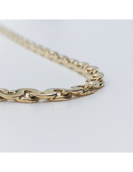 Cadena barbada plana en oro 18kt