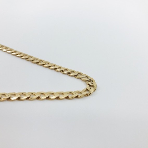 Cadena barbada plana en oro 18kt