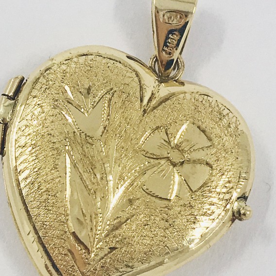 Colgante de oro 18kt en forma de corazÃ³n.