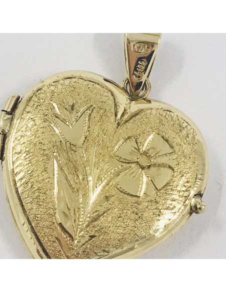 Colgante de oro 18kt en forma de corazÃ³n.