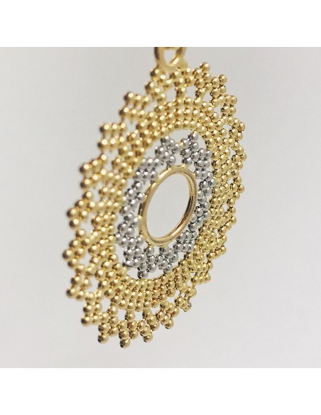 Colgante sol en oro blanco y amarillo.