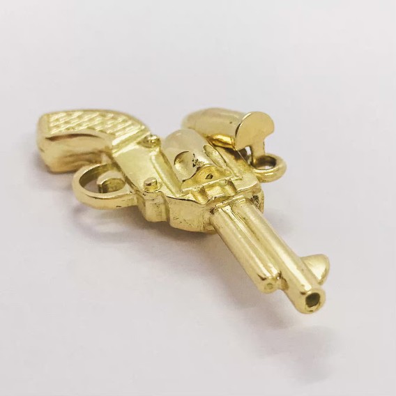 Colgante revÃ³lver en oro 18kt