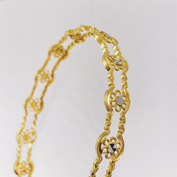 Esclava en oro 18kt con flores.