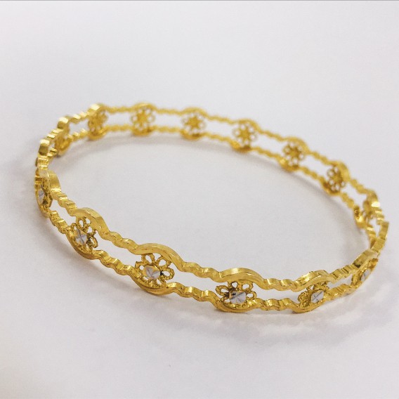 Esclava en oro 18kt con flores.