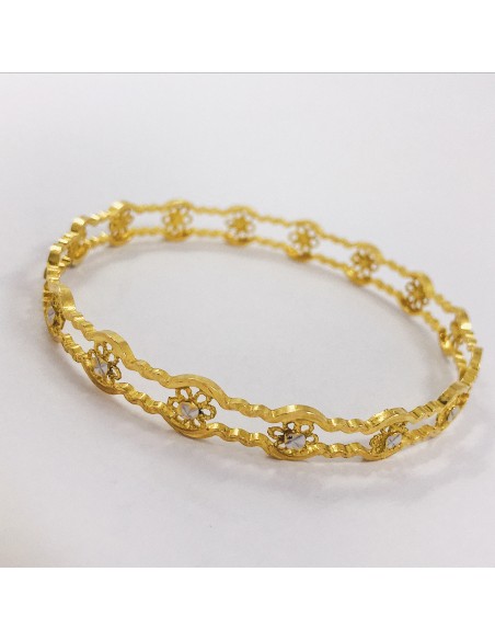 Esclava en oro 18kt con flores.