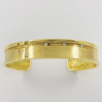 Esclava en oro 18kt. con brillantes.