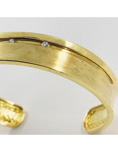 Esclava en oro 18kt. con brillantes.