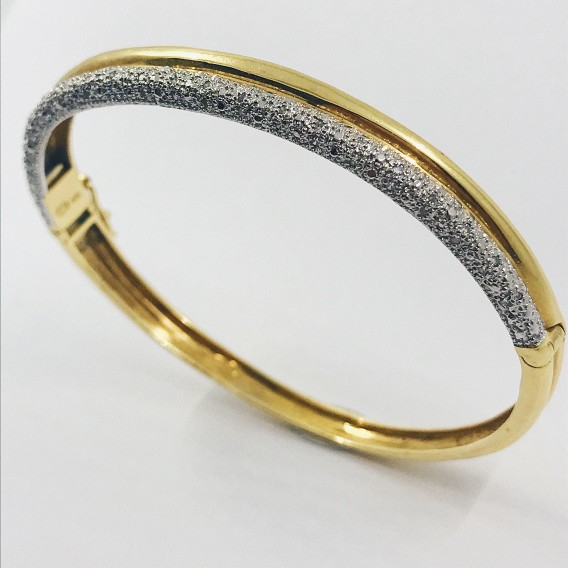 Esclava bicolor en oro blanco y amarillo con brillantes.