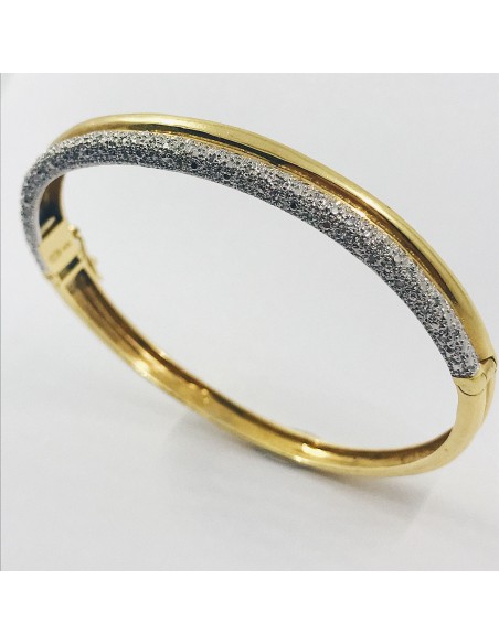 Esclava bicolor en oro blanco y amarillo con brillantes.