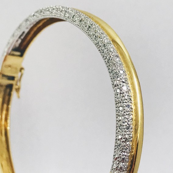 Esclava bicolor en oro blanco y amarillo con brillantes.