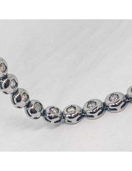 Gargantilla riviere de oro blanco y brillantes.