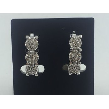 Pendientes en oro y trÃ­o de flores de brillantes