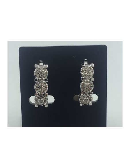 Pendientes en oro y trÃ­o de flores de brillantes