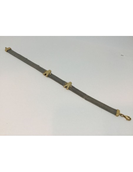 Pulsera Tous de malla de acero con cierre y motivos en oro.