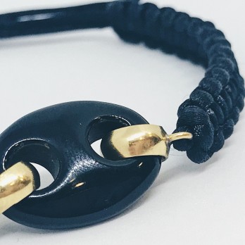 Pulsera  de  cordÃ³n trenzado con oro 18kt 2