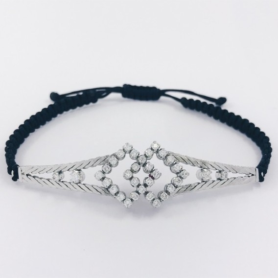 Pulsera en oro blanco con centro de brillantes