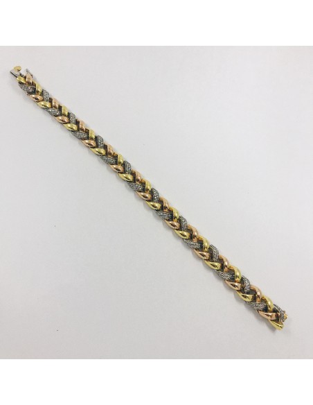 Pulsera en oro trenzado con brillantes.
