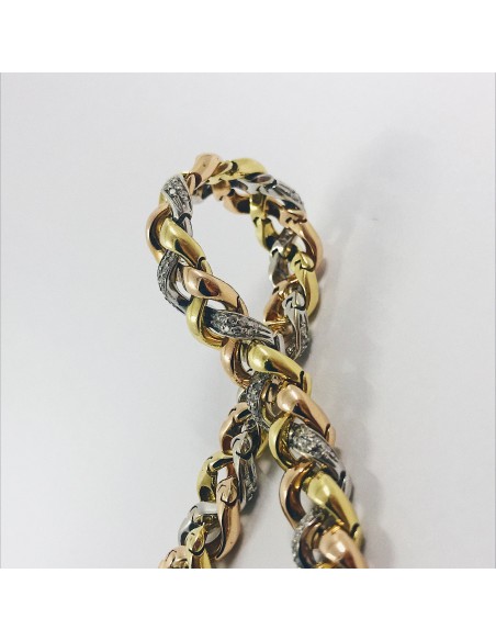 Pulsera en oro trenzado con brillantes.