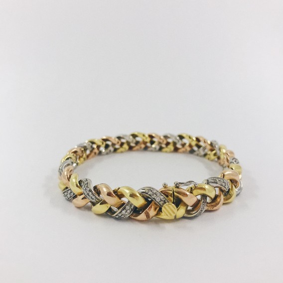 Pulsera en oro trenzado con brillantes.