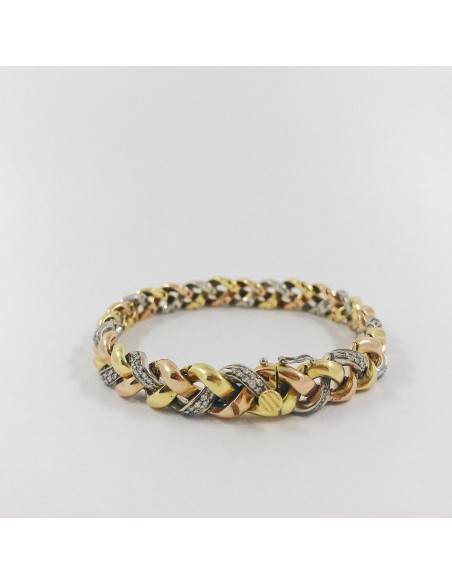 Pulsera en oro trenzado con brillantes.