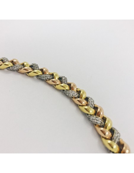 Pulsera en oro trenzado con brillantes.