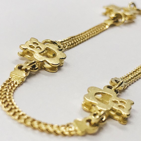 Pulsera con ositos en oro 18kt.