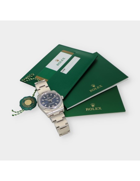 Rolex Oyster Perpetual 114200 caja y documentos