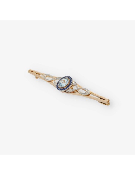 Broche de oro con brillantes, agua marina y zafiros