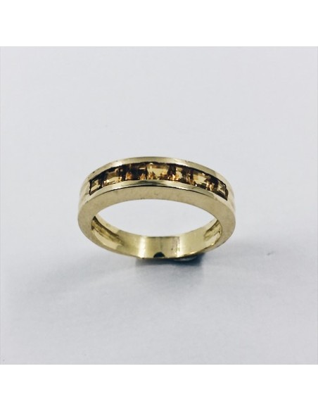 Anillo media alianza de oro y topacios