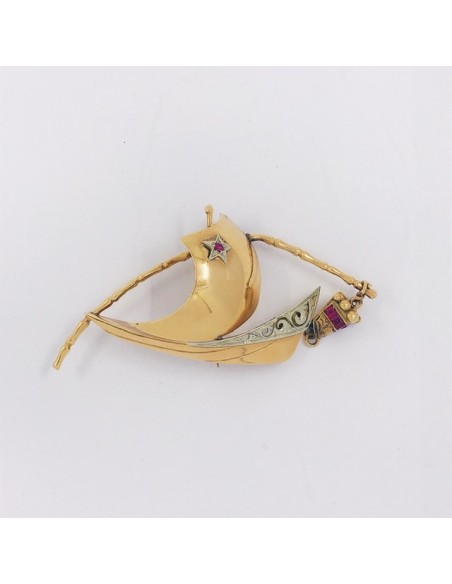 Broche en oro y piedras de color