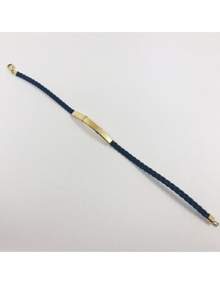 Pulsera con placa de oro y cuero trenzado.