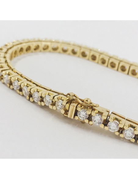 Pulsera riviÃ¨re en oro con brillantes.