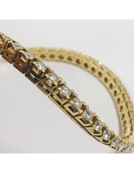 Pulsera riviÃ¨re en oro con brillantes.