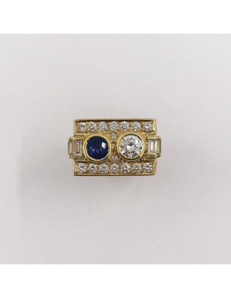 Anillo en oro 18kt con brillantes y zafiro.